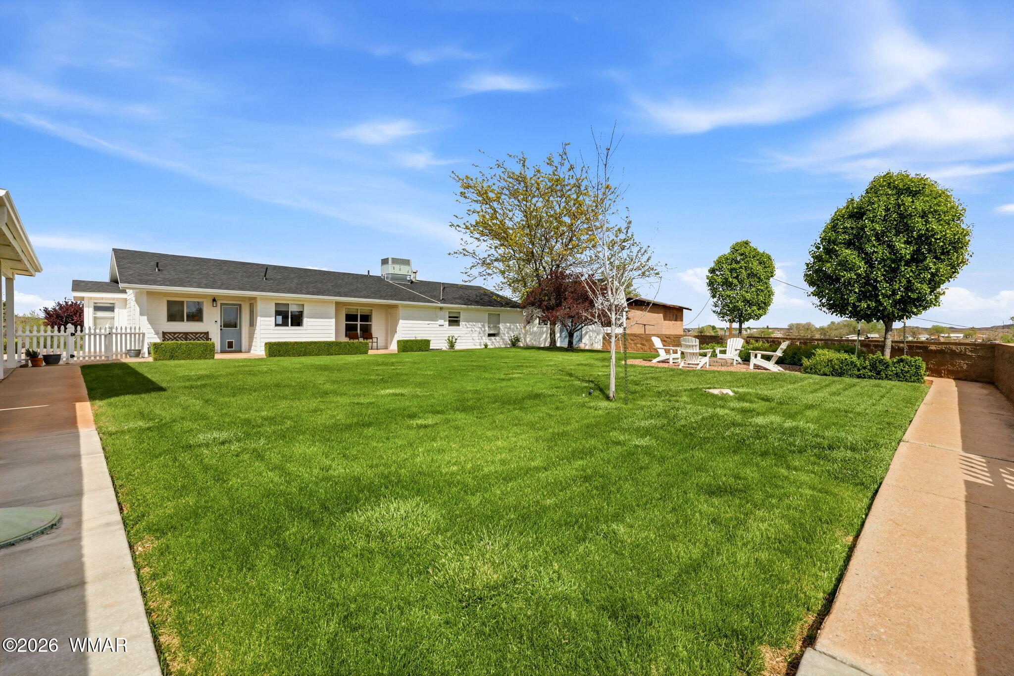 1491 Hunsaker Road Holbrook, AZ 86025 - Photo 25 of 40 a view of a house with a backyard