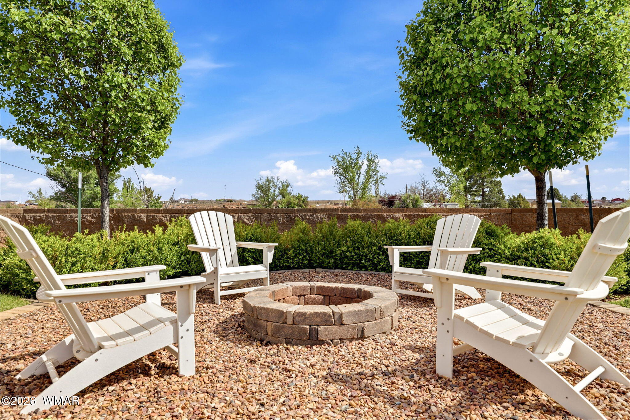 1491 Hunsaker Road Holbrook, AZ 86025 - Photo 27 of 40 a view of a chairs and table in the patio