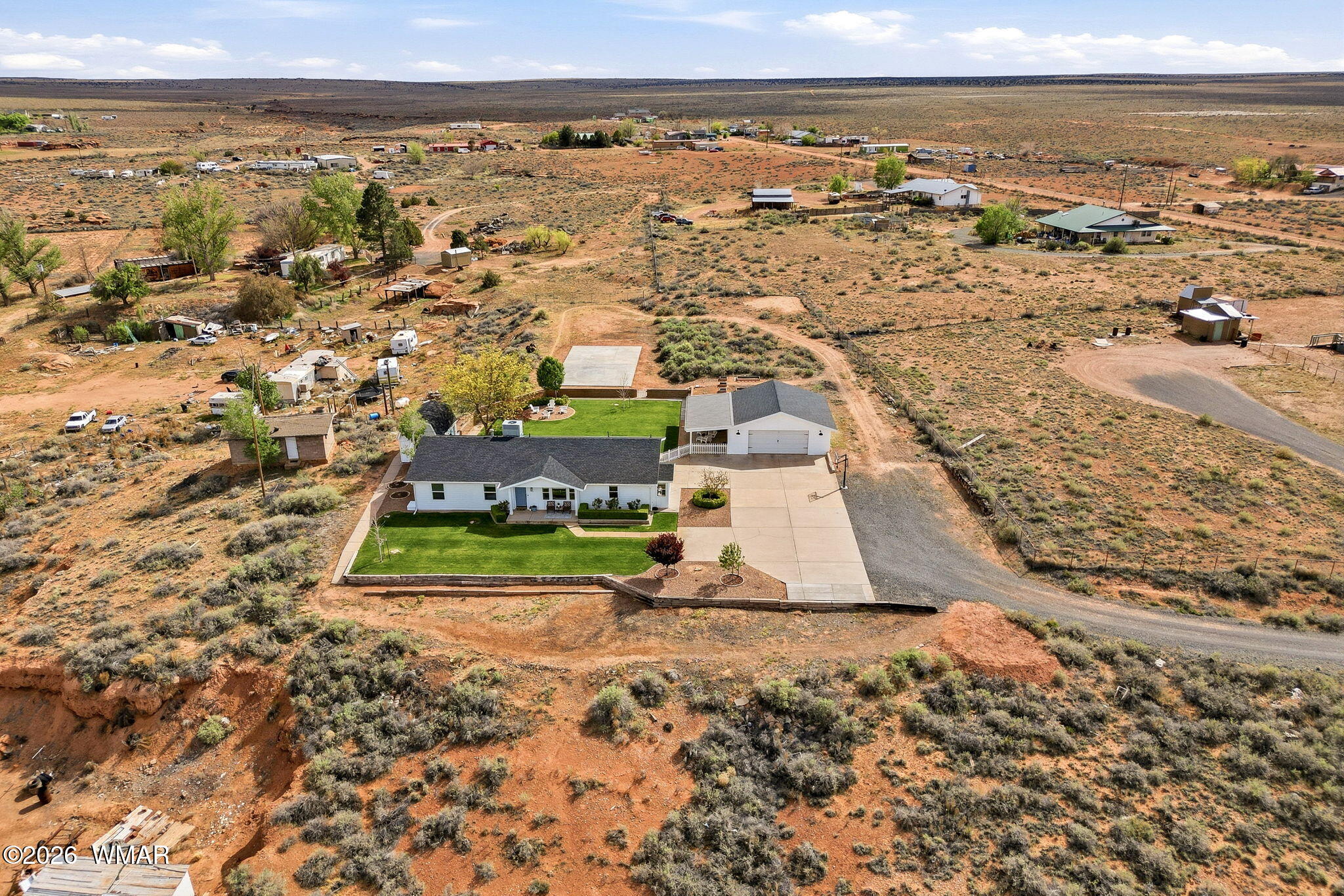 1491 Hunsaker Road Holbrook, AZ 86025 - Photo 36 of 40 an aerial view of residential houses with outdoor space