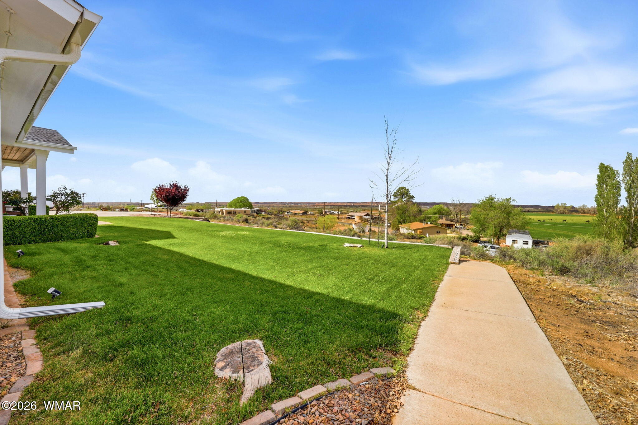 1491 Hunsaker Road Holbrook, AZ 86025 - Photo 6 of 40 a view of a garden and basketball court