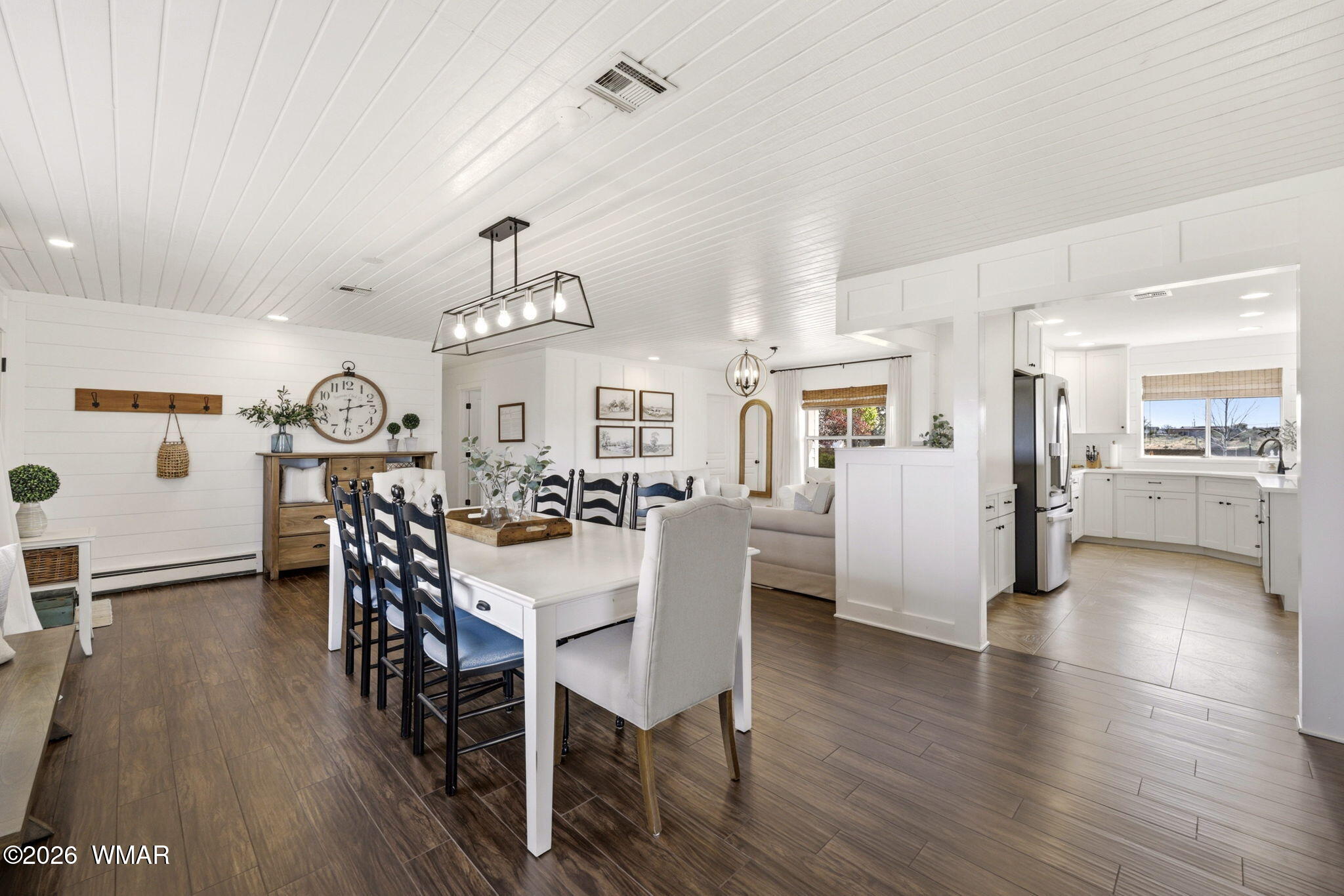 1491 Hunsaker Road Holbrook, AZ 86025 - Photo 9 of 40 a view of a dining room with furniture and wooden floor