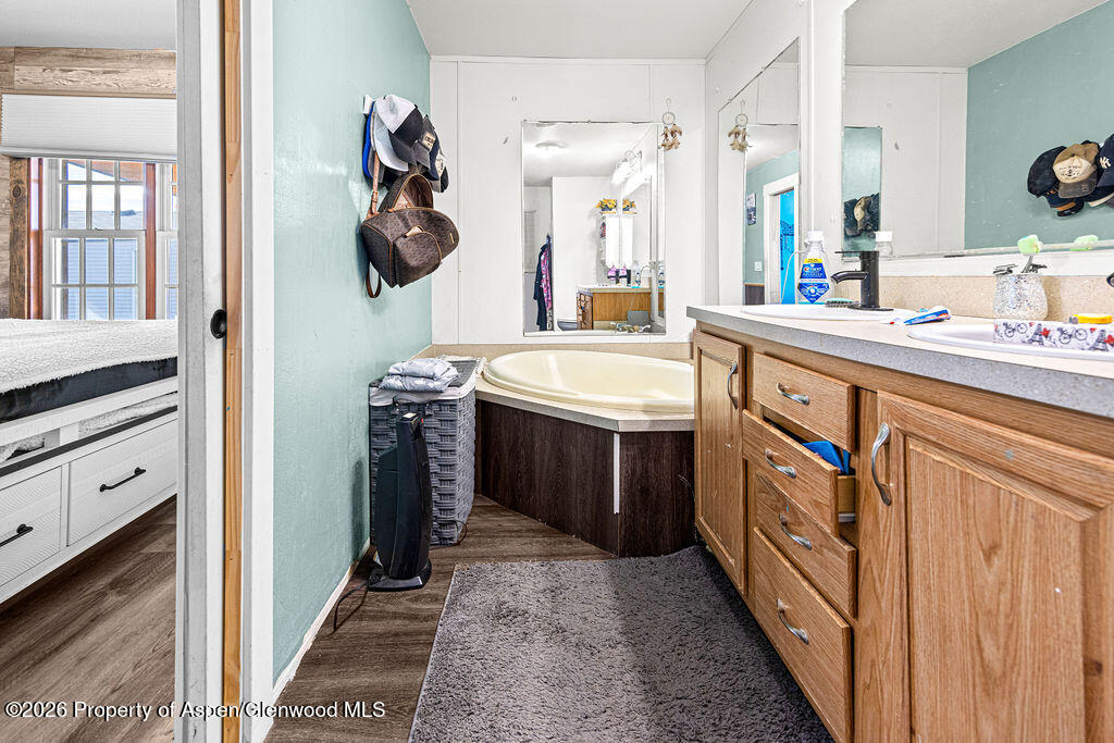 925 West 1st Street, Unit 511 Craig, CO 81625 - Photo 12 of 28 a bathroom with a sink and a mirror