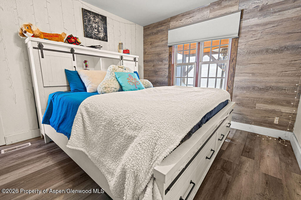 925 West 1st Street, Unit 511 Craig, CO 81625 - Photo 14 of 28 a bed sitting in a bedroom next to a window