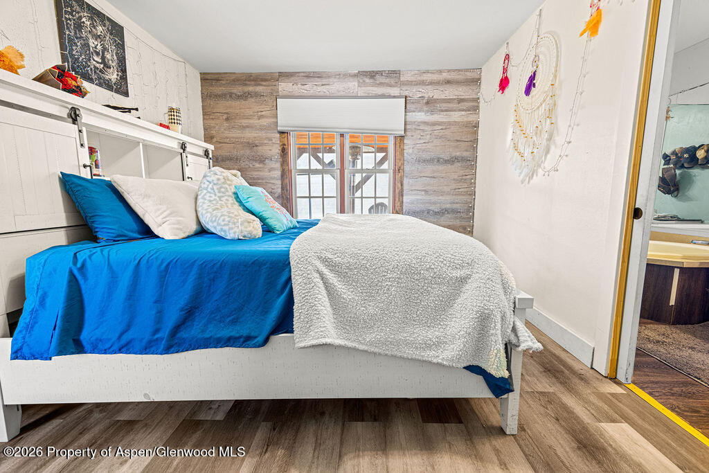 925 West 1st Street, Unit 511 Craig, CO 81625 - Photo 15 of 28 a living room with furniture and a wooden floor