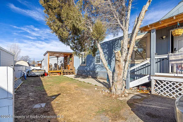 a view of a house with backyard porch and sitting area