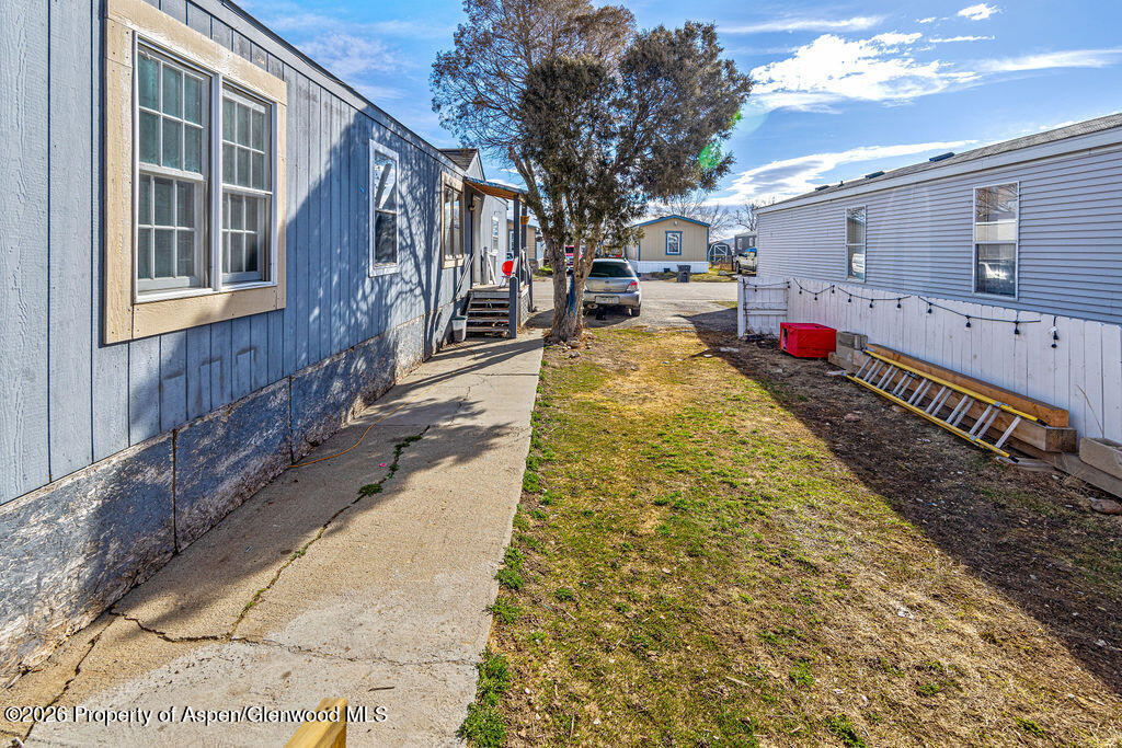 925 West 1st Street, Unit 511 Craig, CO 81625 - Photo 28 of 28 a swimming pool with yard and outdoor seating
