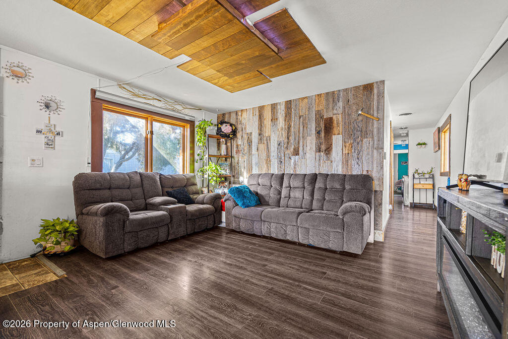 925 West 1st Street, Unit 511 Craig, CO 81625 - Photo 7 of 28 a living room with furniture and a large window