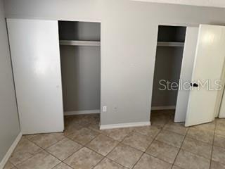 2744 Hidden Lake Boulevard, Unit C Sarasota, FL 34237 - Photo 2 of 6 an empty room with closet