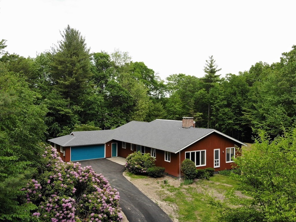 73 Bolton Road Harvard, MA 01451 - Photo 1 of 28 a house with trees in the background