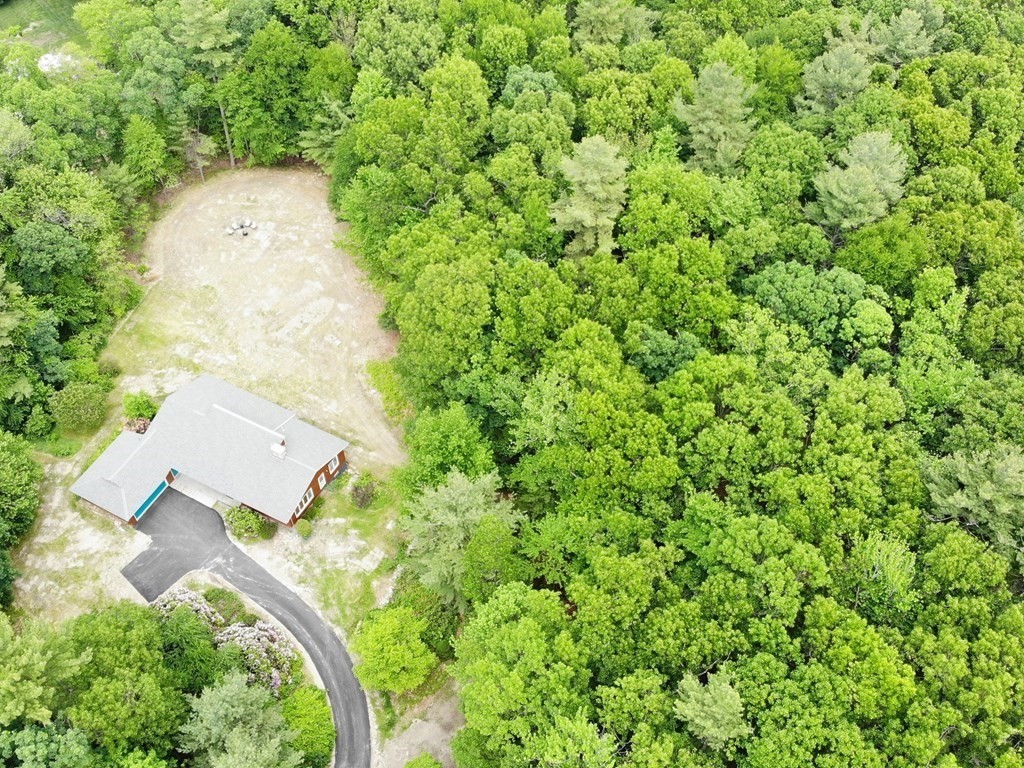 73 Bolton Road Harvard, MA 01451 - Photo 28 of 28 an aerial view of a house with a yard and parking space