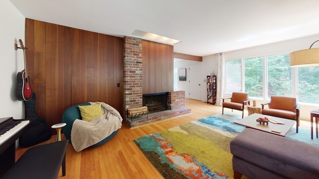 73 Bolton Road Harvard, MA 01451 - Photo 3 of 28 a living room with furniture and a fireplace