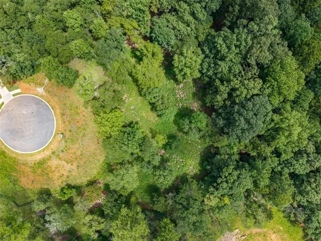 a aerial view of a house with a swimming pool