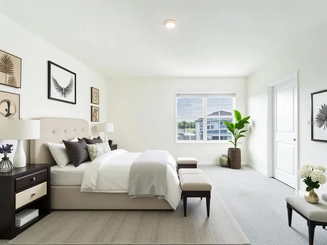 a bedroom with bed and a couch