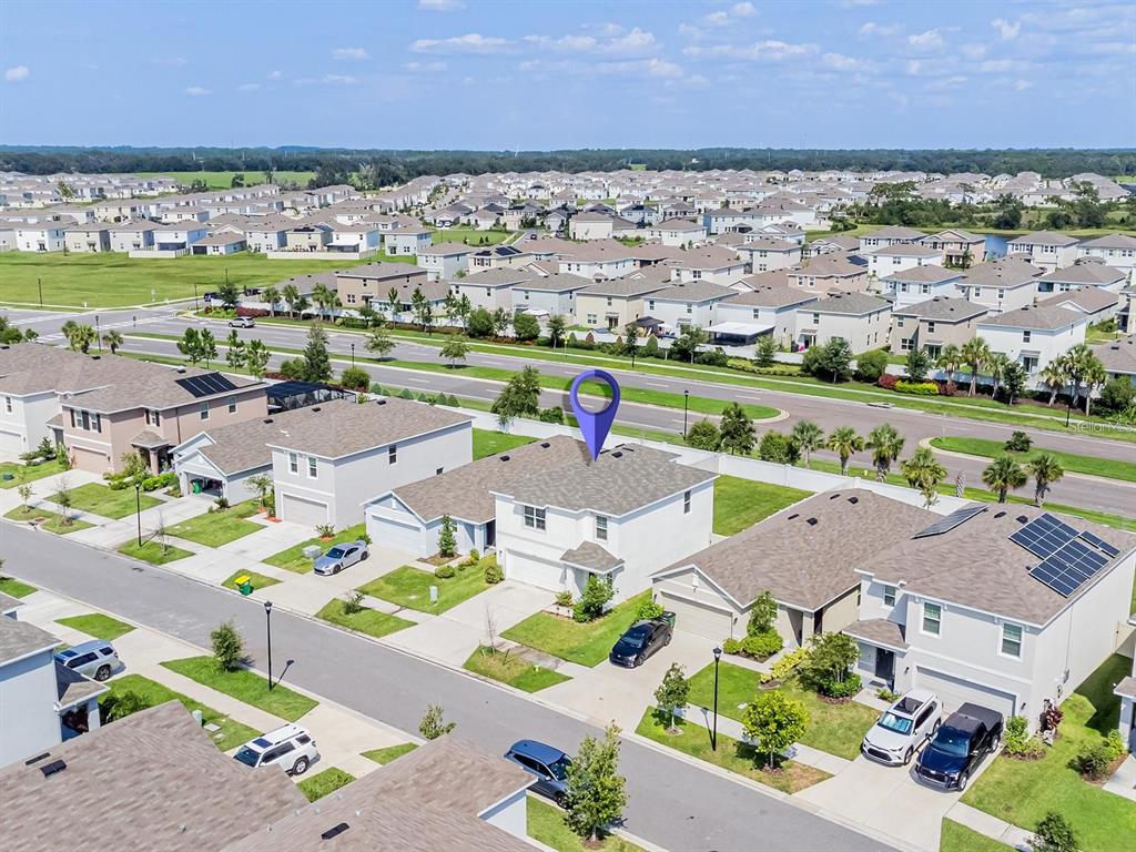 5510 Oxford Gray Road Wesley Chapel, FL 33545 - Photo 12 of 41 an aerial view of tennis court