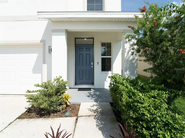 a view of a pathway besides a house