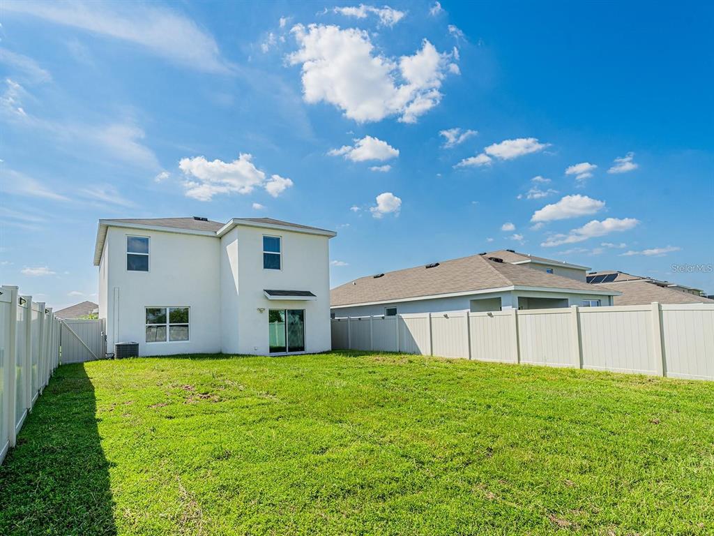 5510 Oxford Gray Road Wesley Chapel, FL 33545 - Photo 15 of 41 a house view with a garden space