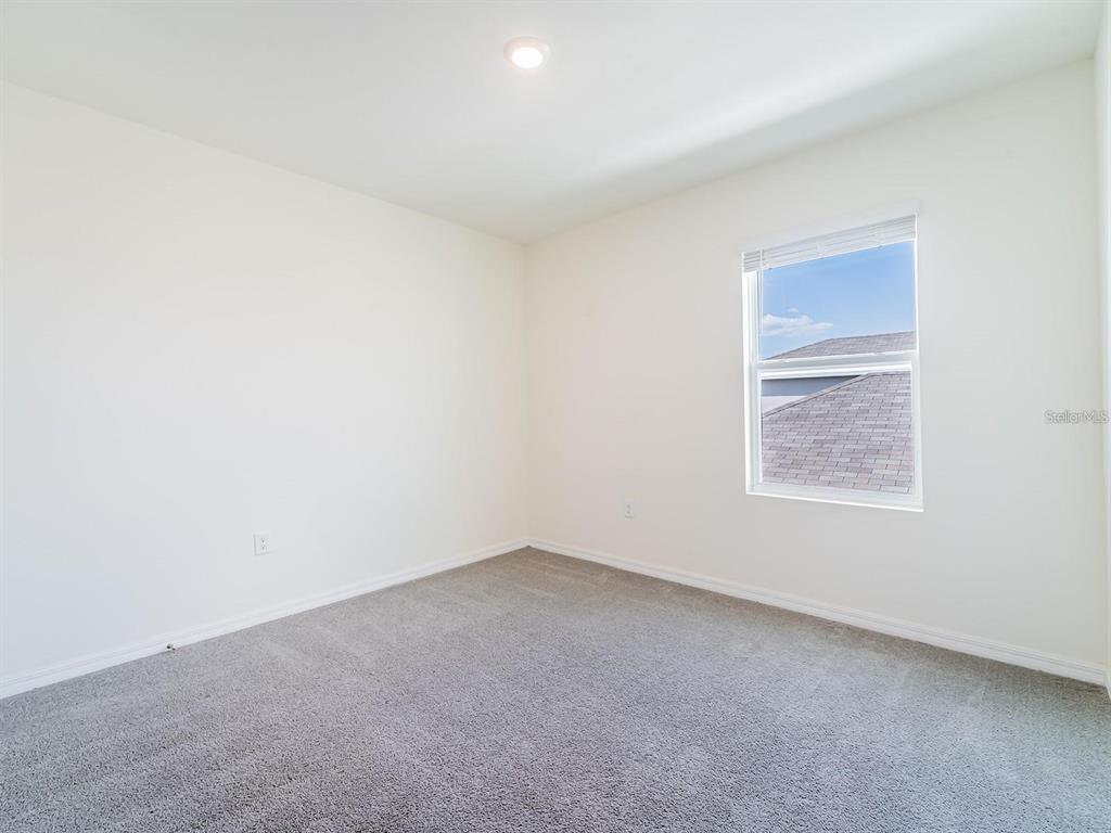 5510 Oxford Gray Road Wesley Chapel, FL 33545 - Photo 17 of 41 an empty room with a window