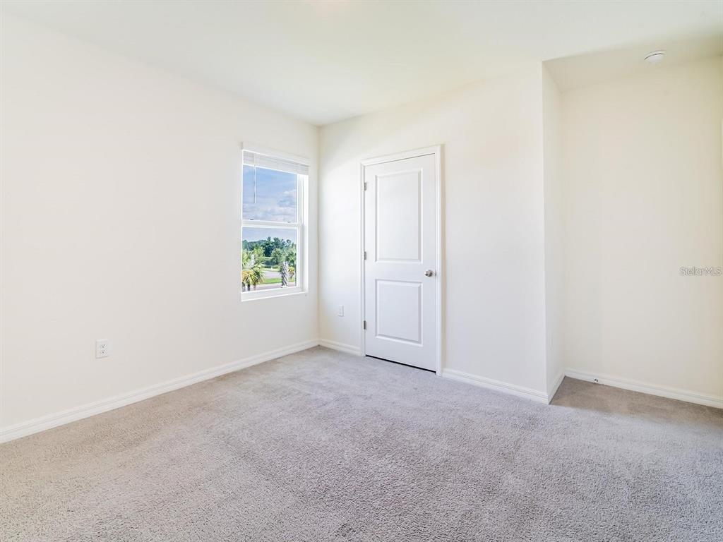 5510 Oxford Gray Road Wesley Chapel, FL 33545 - Photo 19 of 41 an empty room with windows