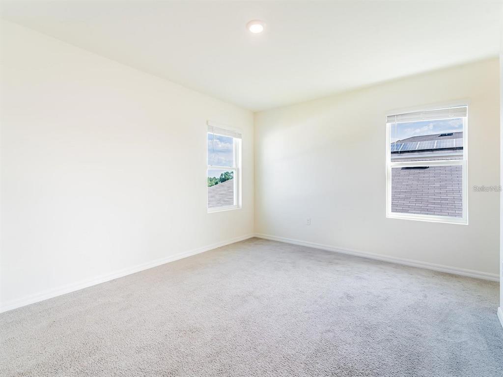 5510 Oxford Gray Road Wesley Chapel, FL 33545 - Photo 20 of 41 an empty room with windows