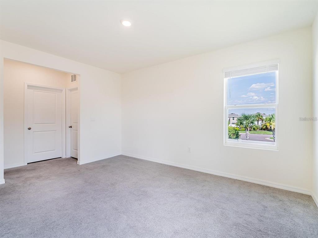 5510 Oxford Gray Road Wesley Chapel, FL 33545 - Photo 21 of 41 an empty room with windows