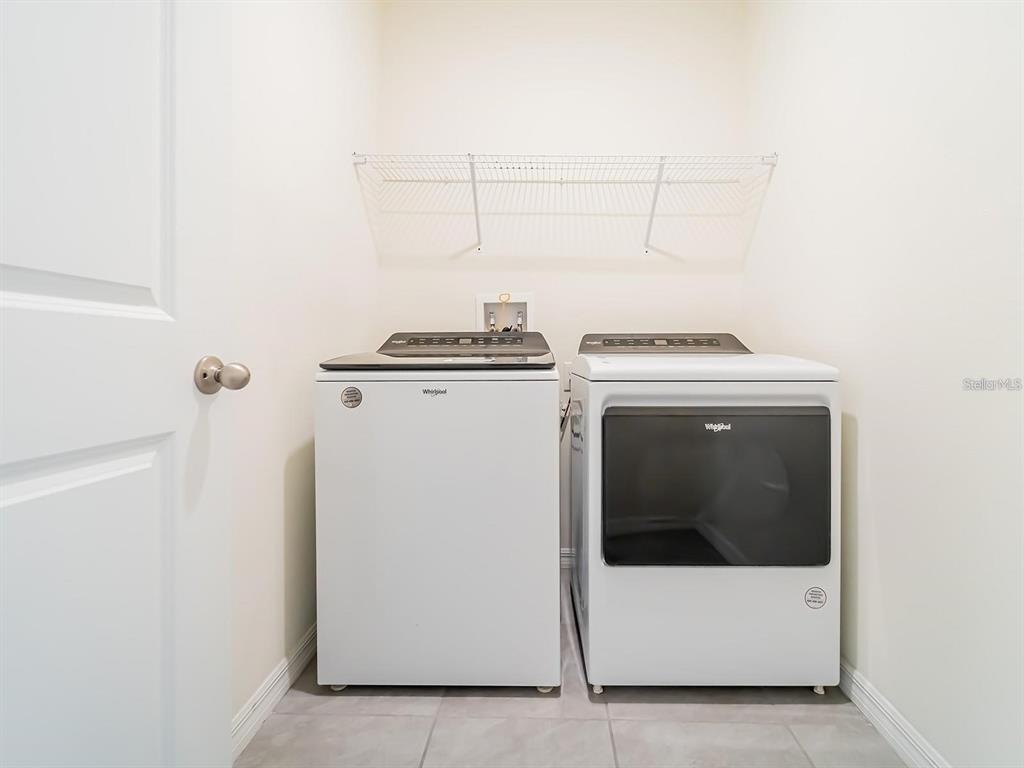 5510 Oxford Gray Road Wesley Chapel, FL 33545 - Photo 23 of 41 a utility room with dryer and washer