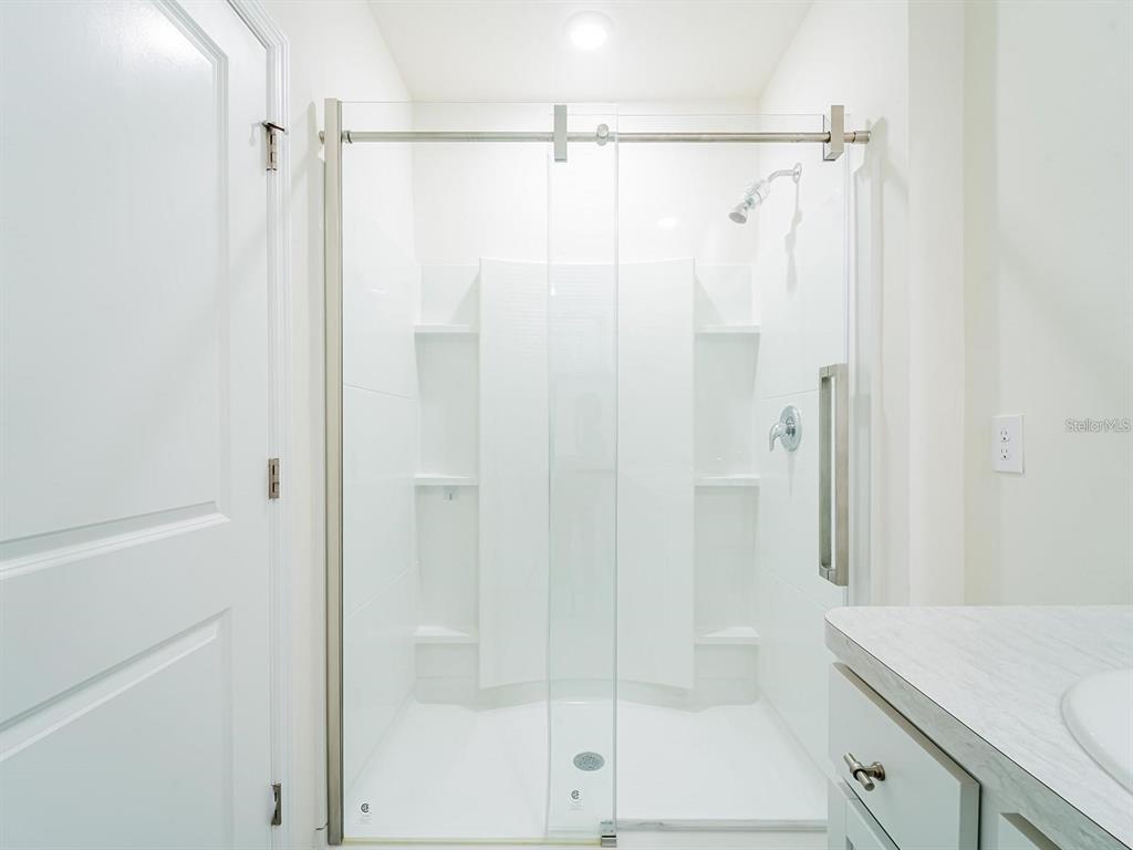 5510 Oxford Gray Road Wesley Chapel, FL 33545 - Photo 25 of 41 a bathroom with a shower and a sink