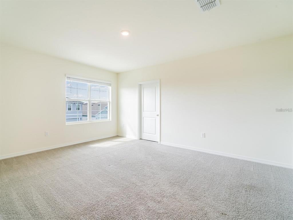 5510 Oxford Gray Road Wesley Chapel, FL 33545 - Photo 28 of 41 an empty room with windows