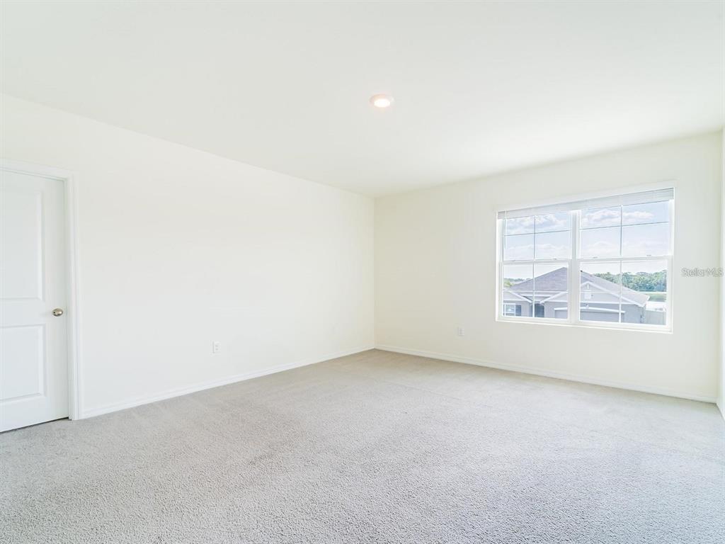 5510 Oxford Gray Road Wesley Chapel, FL 33545 - Photo 29 of 41 an empty room with a window