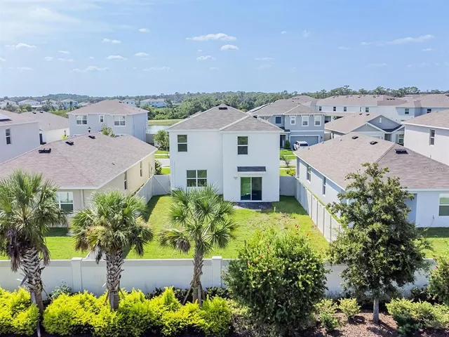 an aerial view of a house with a garden