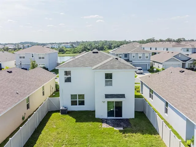 a aerial view of a house with a yard