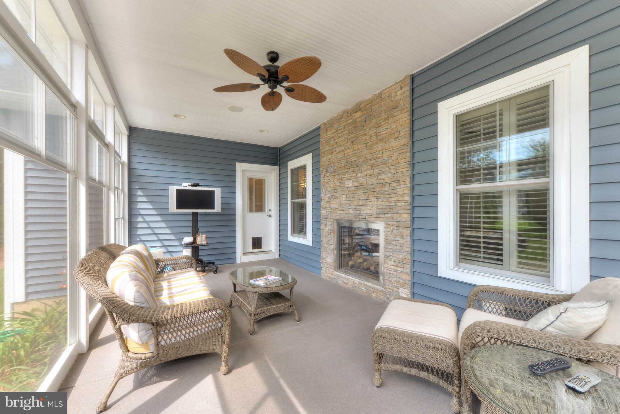 35494 Red Tail Road Lewes, DE 19958 - Photo 11 of 46 Back Porch. Lounge by the double sided fireplace!