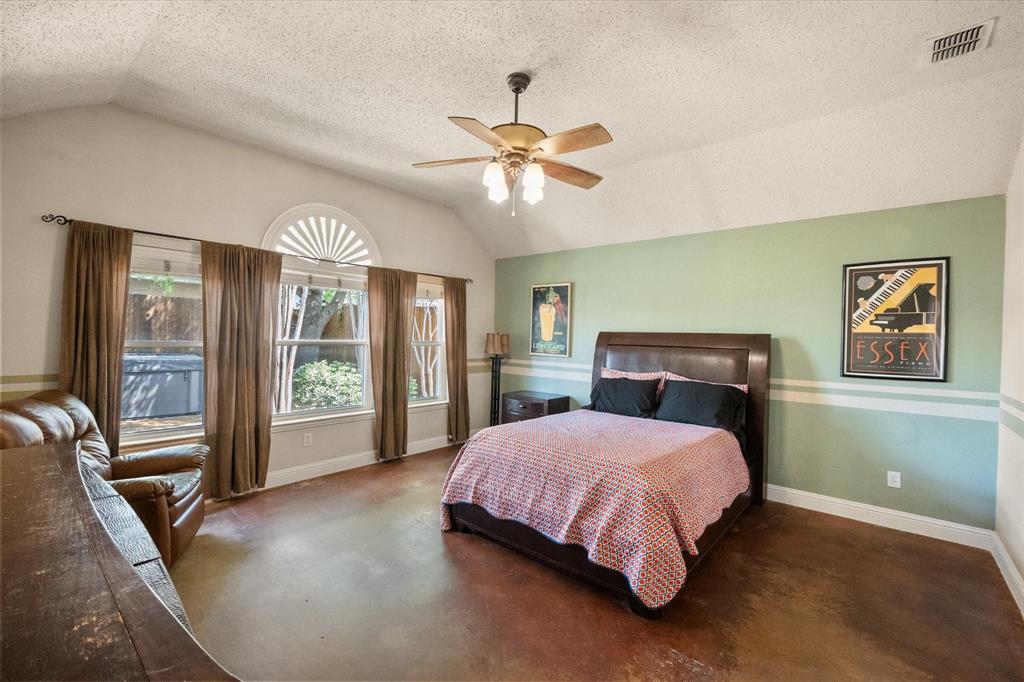 1305 Liverpool Lane Mansfield, TX 76063 - Photo 15 of 40 This inviting room features vaulted ceilings, rich brown flooring, and a ceiling fan with light fixture