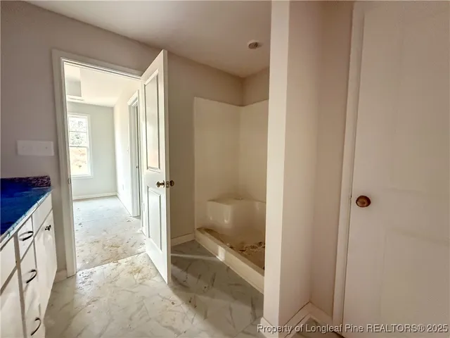 a view of a bathroom with a glass door