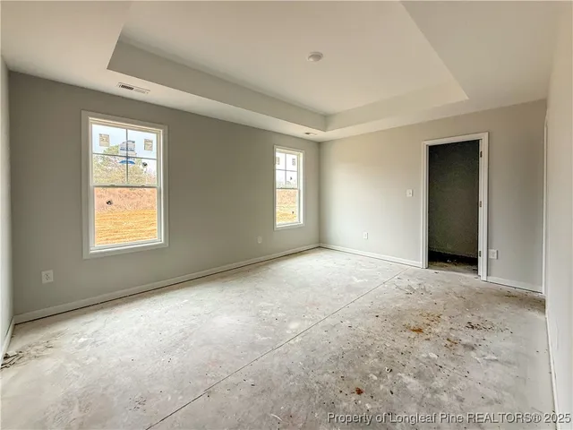 a view of an empty room with windows