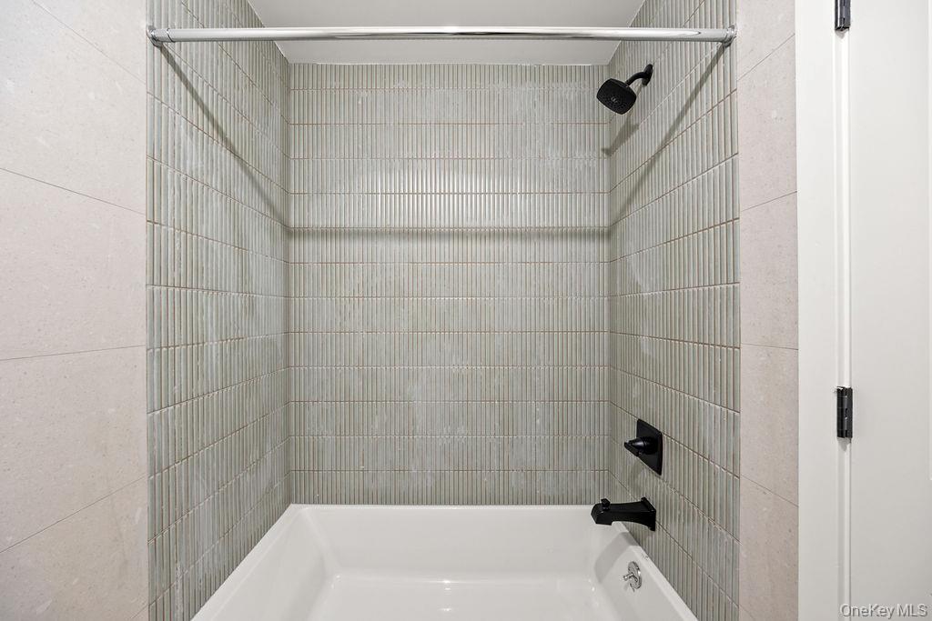 62 Blauvelt Road, Unit 202 Monsey, NY 10952 - Photo 28 of 34 a bathroom with a bathtub