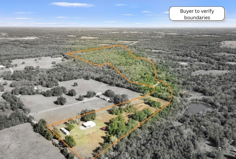 an aerial view of beach with ocean view