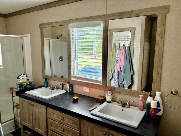 a bathroom with a sink and a mirror