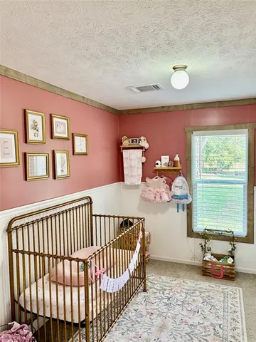 a bedroom with furniture and a window