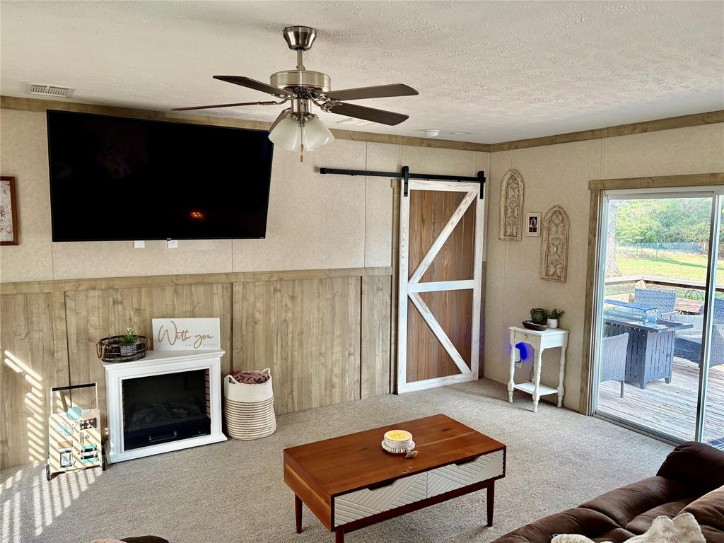 184 Fcr 941 Teague, TX 75860 - Photo 26 of 26 a living room with a flat screen tv and a fireplace