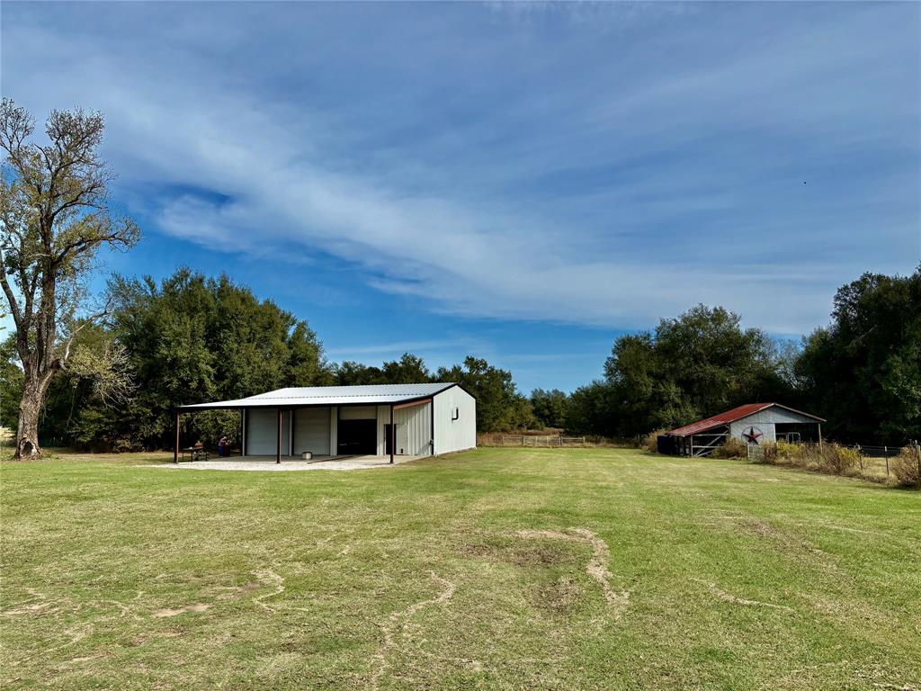 184 Fcr 941 Teague, TX 75860 - Photo 7 of 26 a yellow and green field with lots of trees in the background