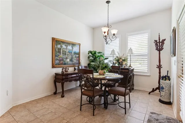 a bedroom with a bed window and dresser