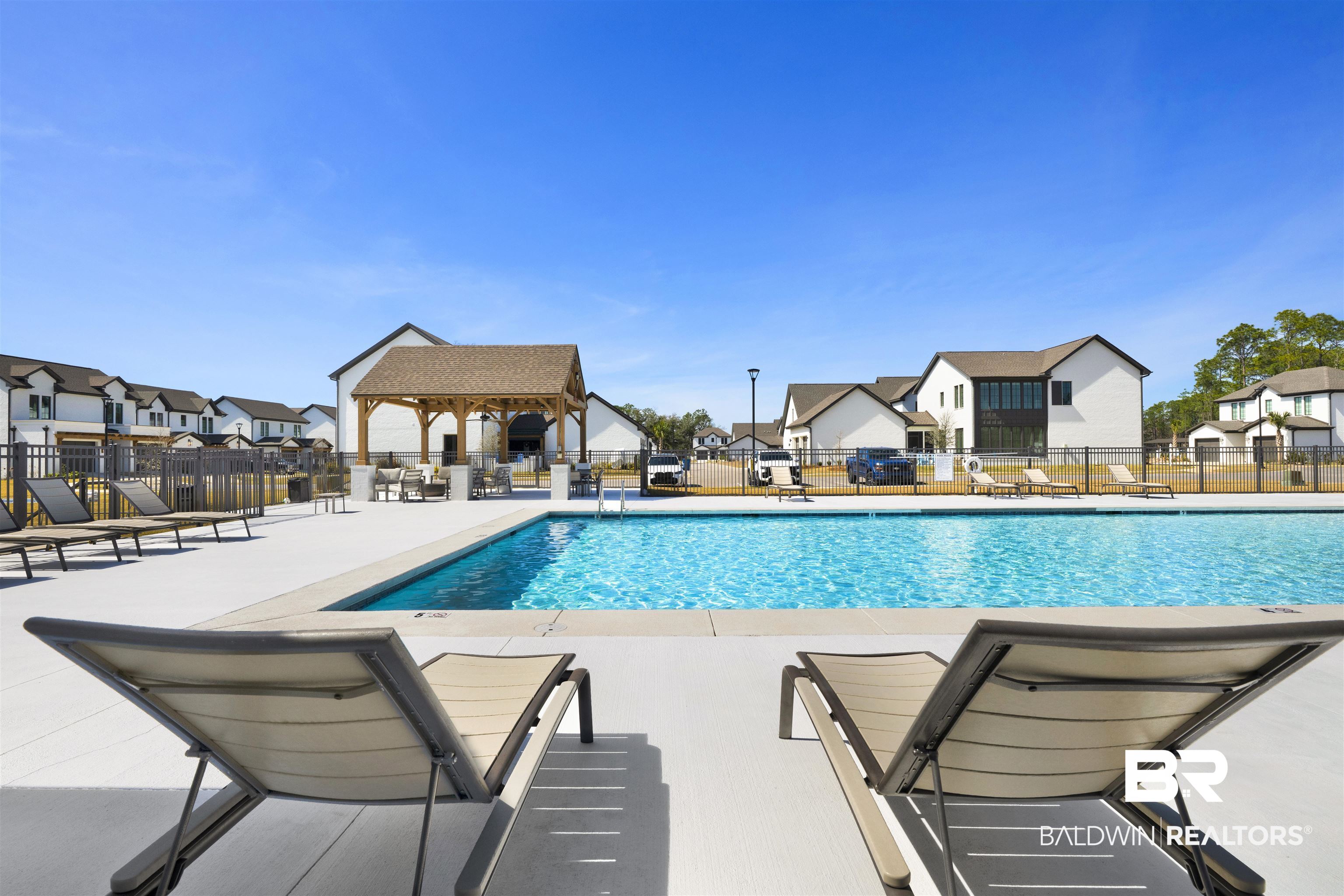 861 Inlet Circle Gulf Shores, AL 36542 - Photo 44 of 54 Community pool with a patio area and a residential view