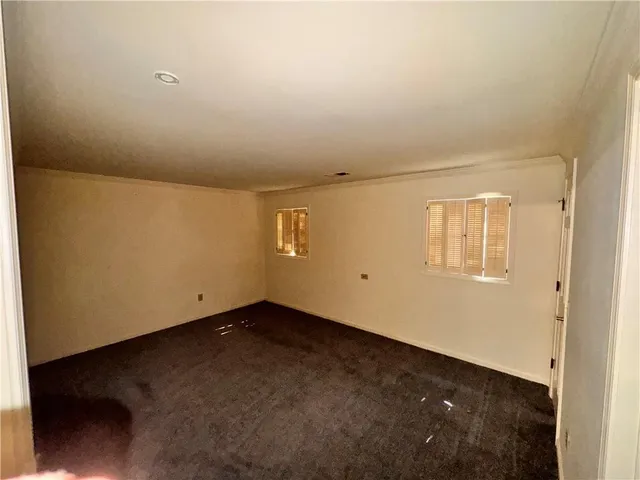 a white toilet sitting next to a sink
