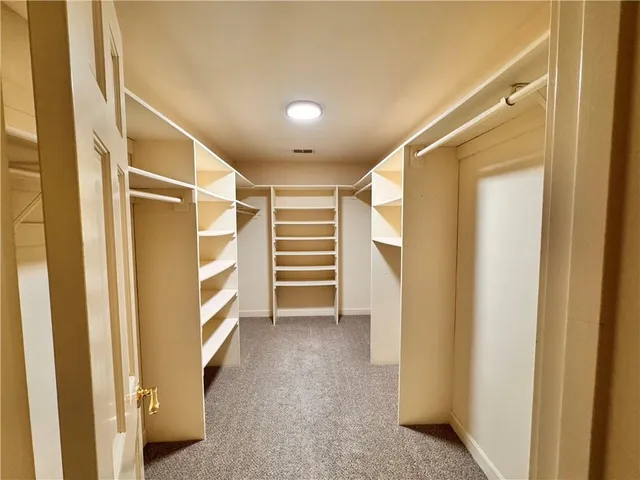 a bathroom with a tub a sink and a shower