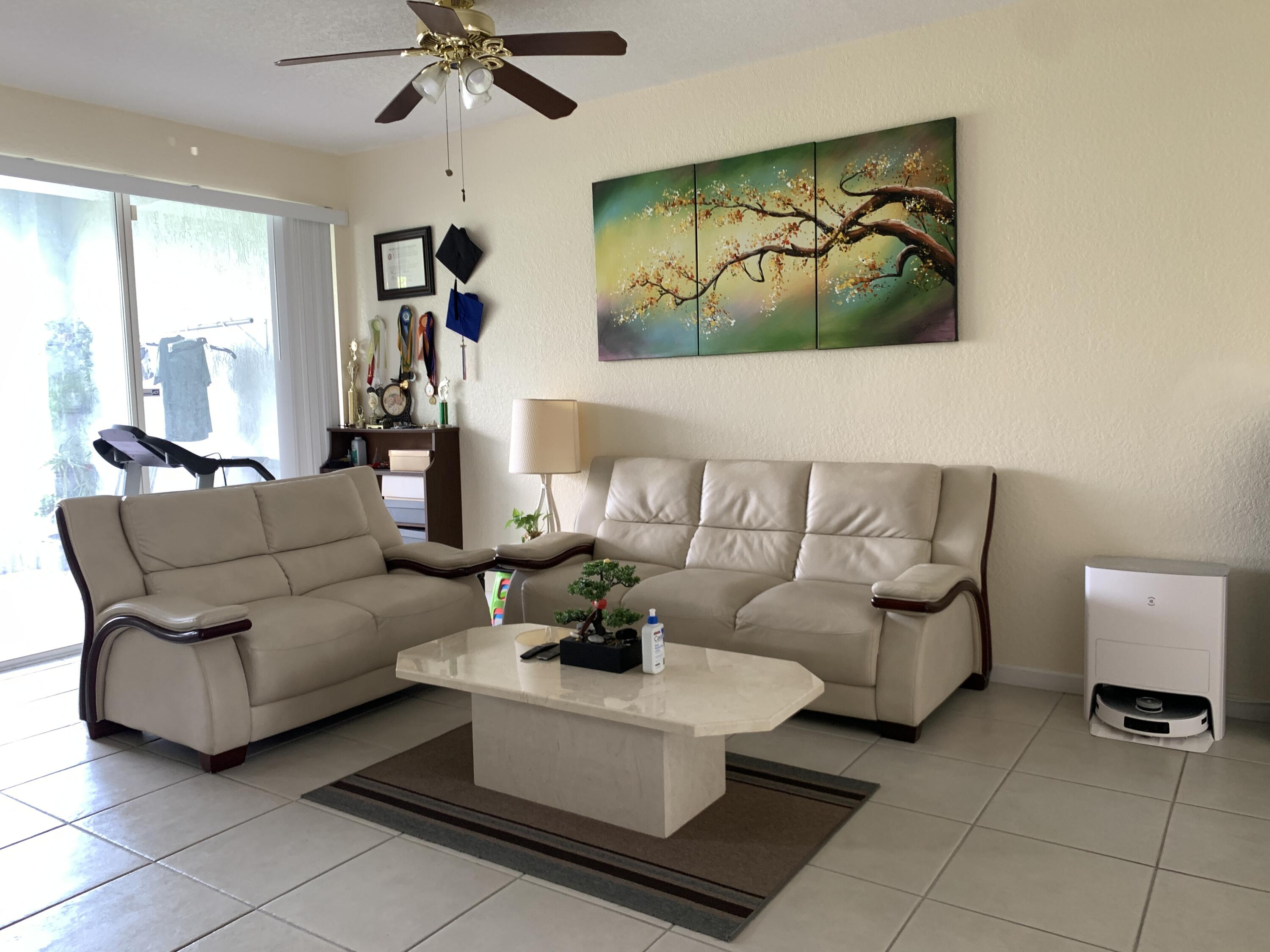 2304 Center Stone Lane Riviera Beach, FL 33404 - Photo 2 of 15 a living room with furniture and a large window