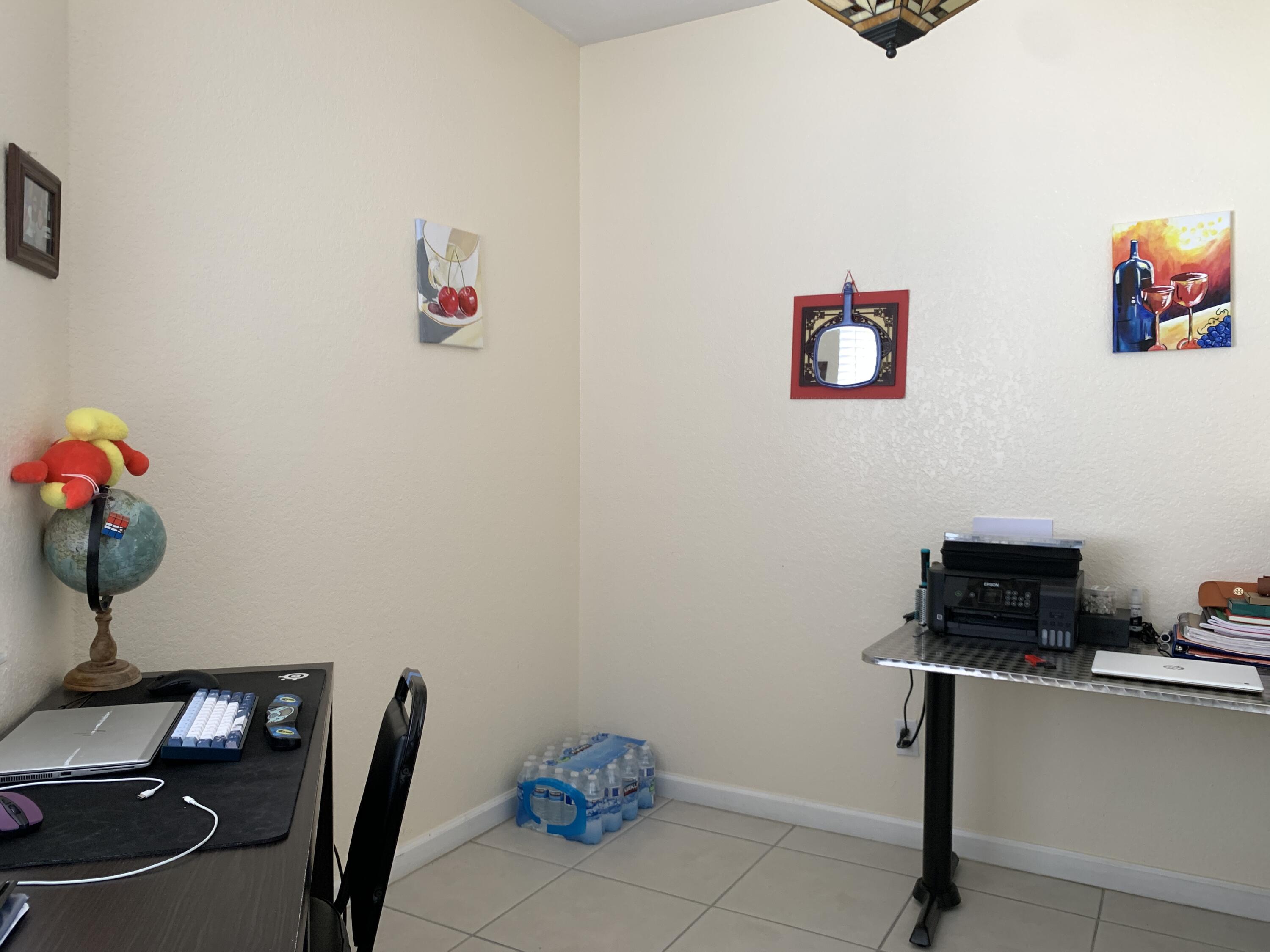 2304 Center Stone Lane Riviera Beach, FL 33404 - Photo 4 of 15 a room with a workspace