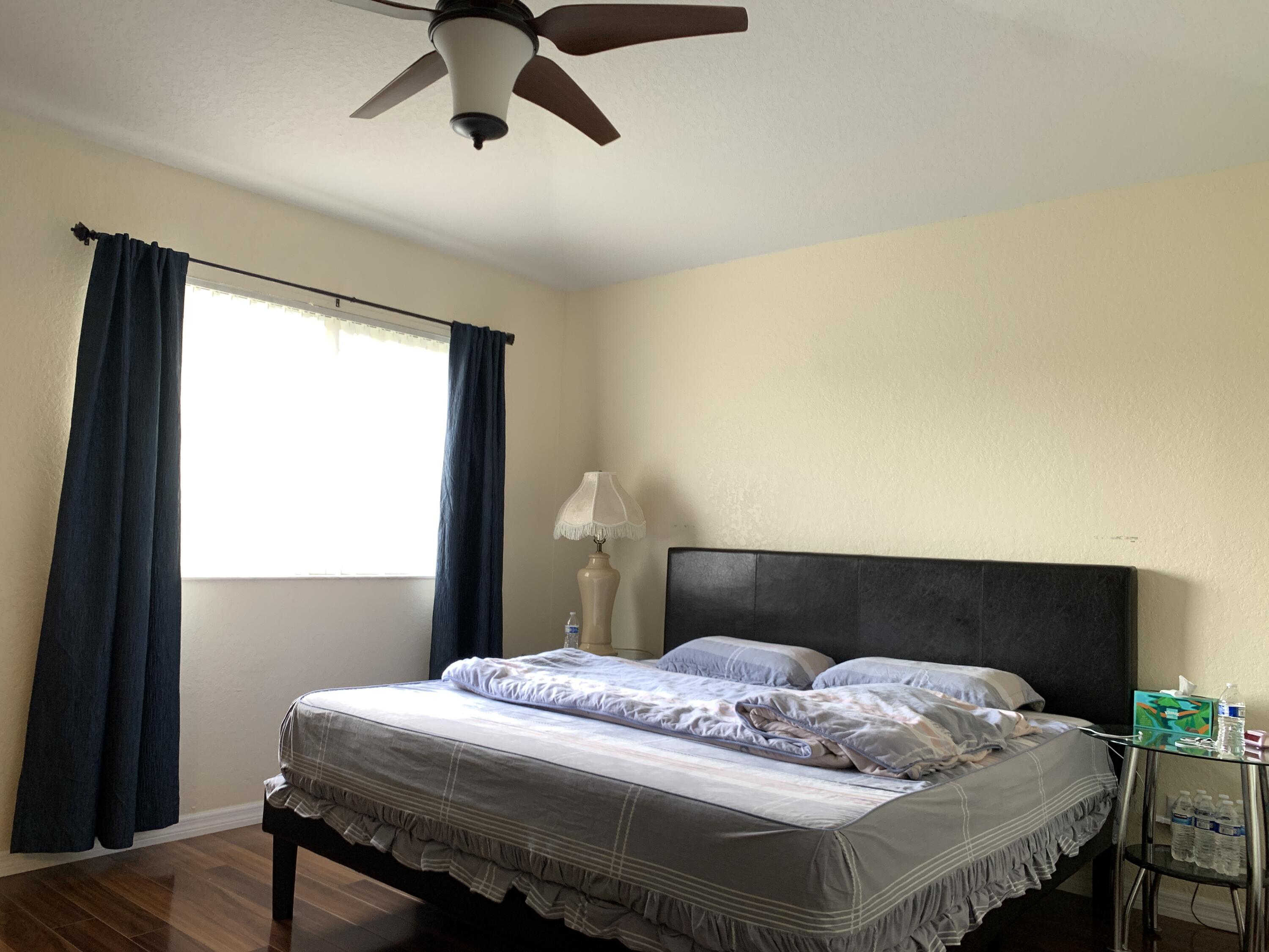 2304 Center Stone Lane Riviera Beach, FL 33404 - Photo 9 of 15 a bedroom with a bed and window