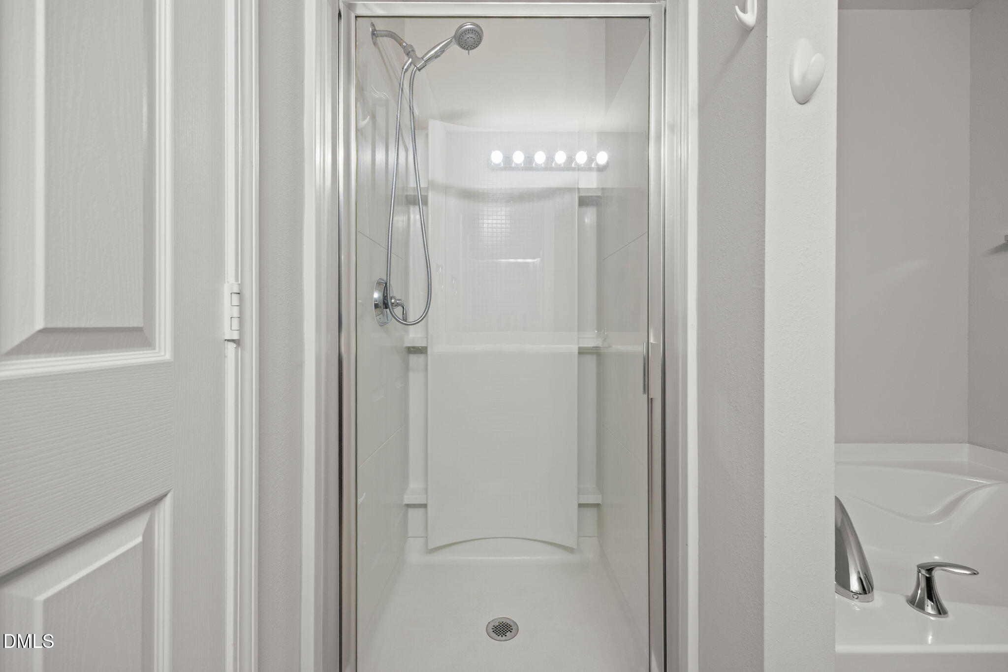 45 Crane Way Bunnlevel, NC 28323 - Photo 26 of 35 a bathroom with a glass shower door