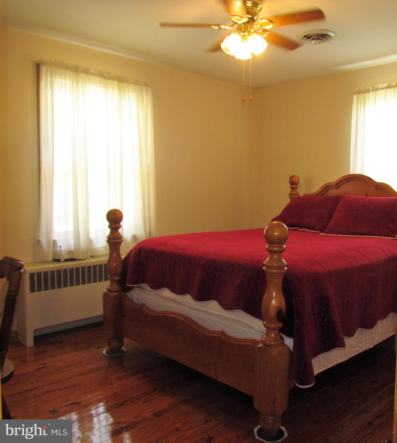 6442 Mt Phillip Road Frederick, MD 21703 - Photo 11 of 37 a bedroom with a bed and a window
