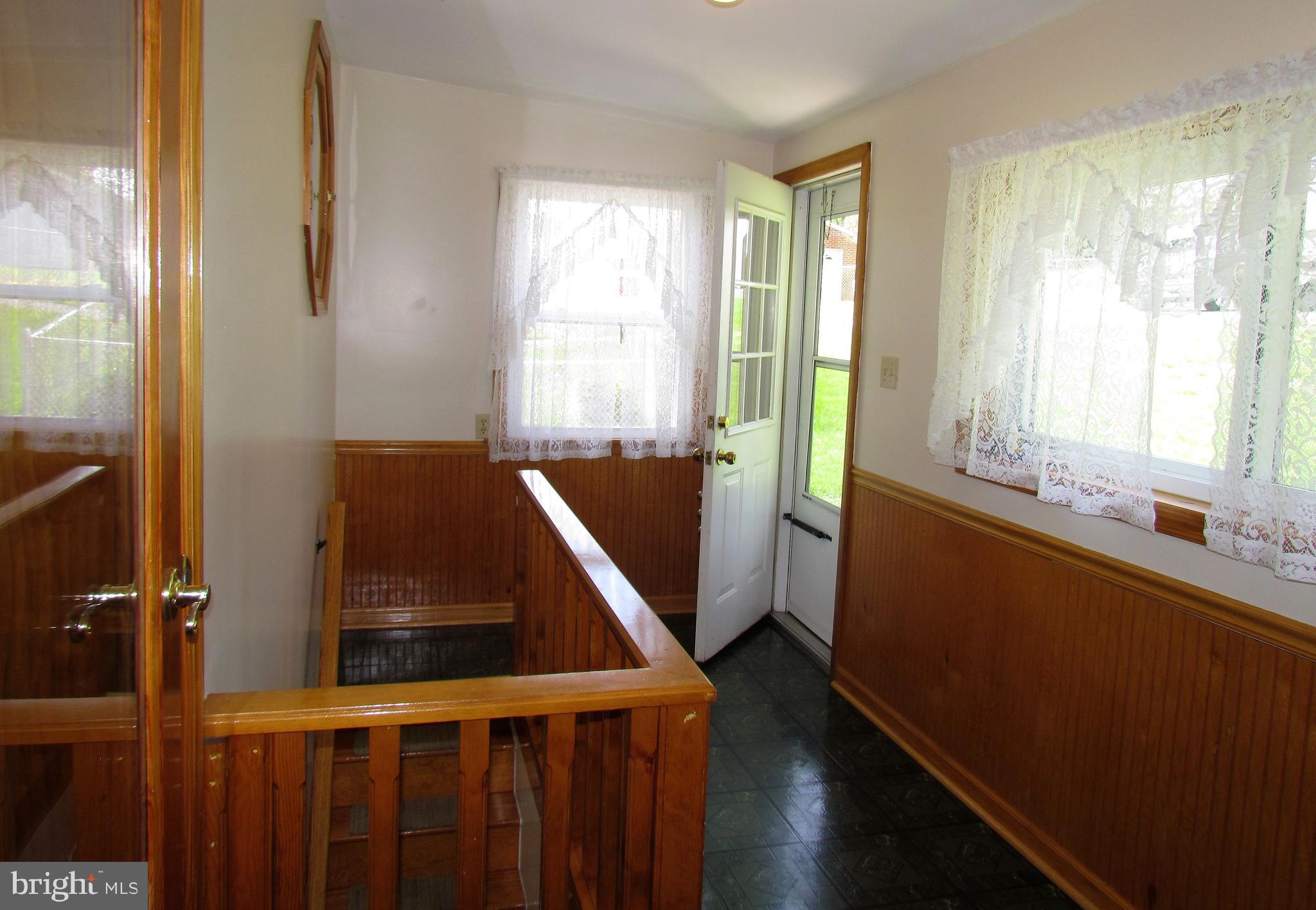 6442 Mt Phillip Road Frederick, MD 21703 - Photo 16 of 37 a view of a room with wooden floor and windows